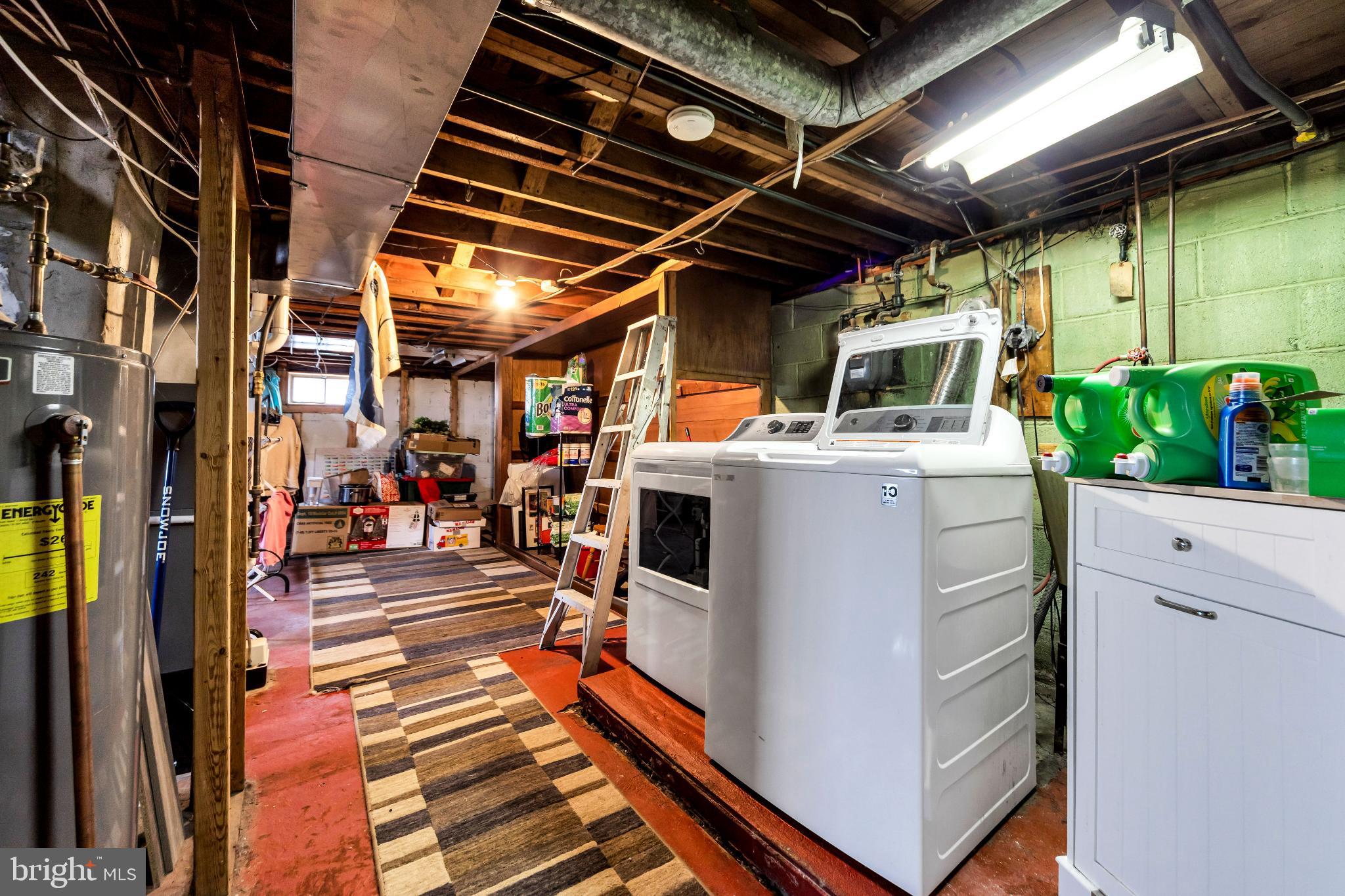 205 Warren Avenue Bellmawr, NJ 08031 - Photo 18 of 25 Spacious basement laundry area with utility charm.