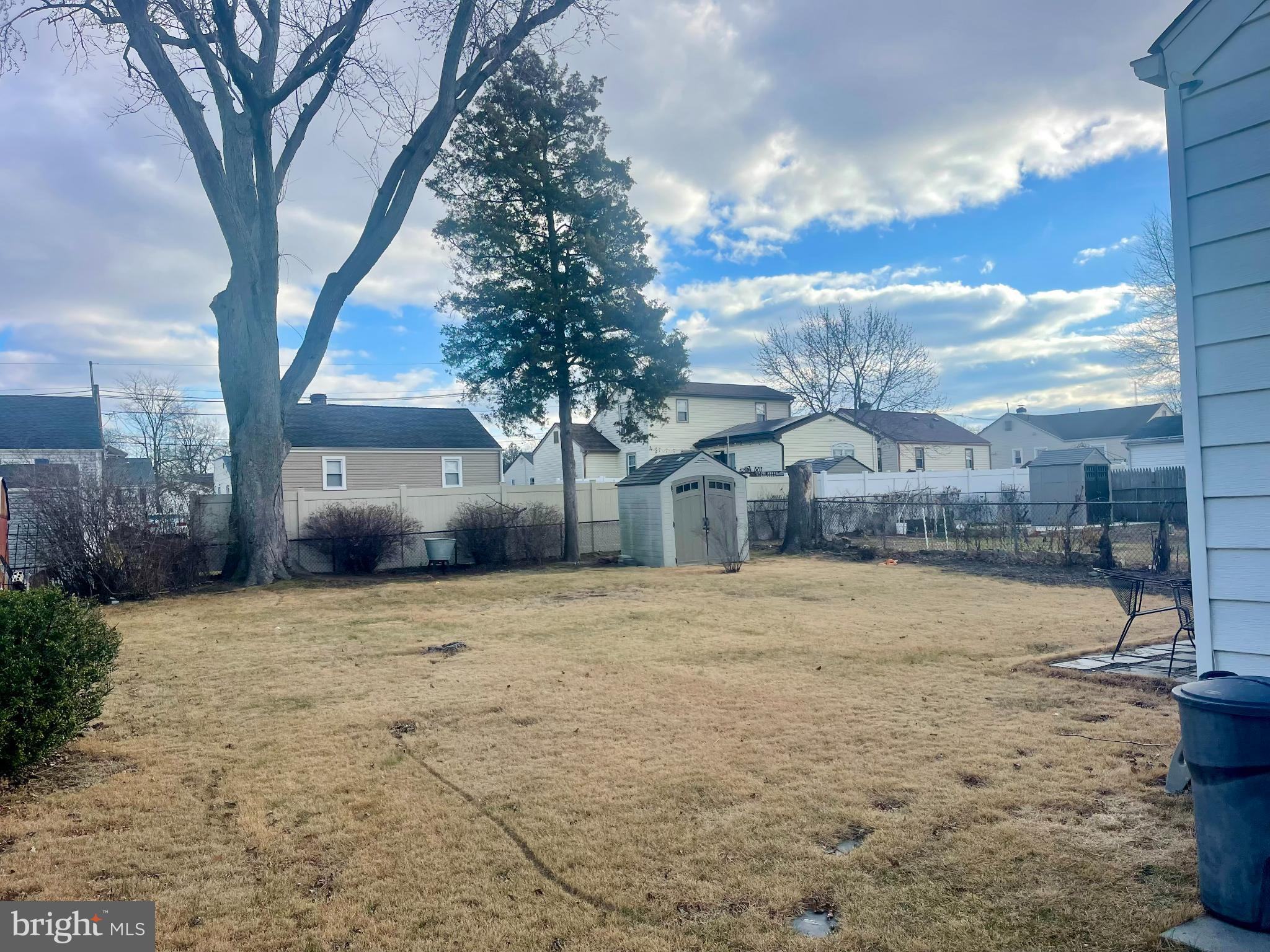 205 Warren Avenue Bellmawr, NJ 08031 - Photo 25 of 25 Spacious backyard with serene sky views.
