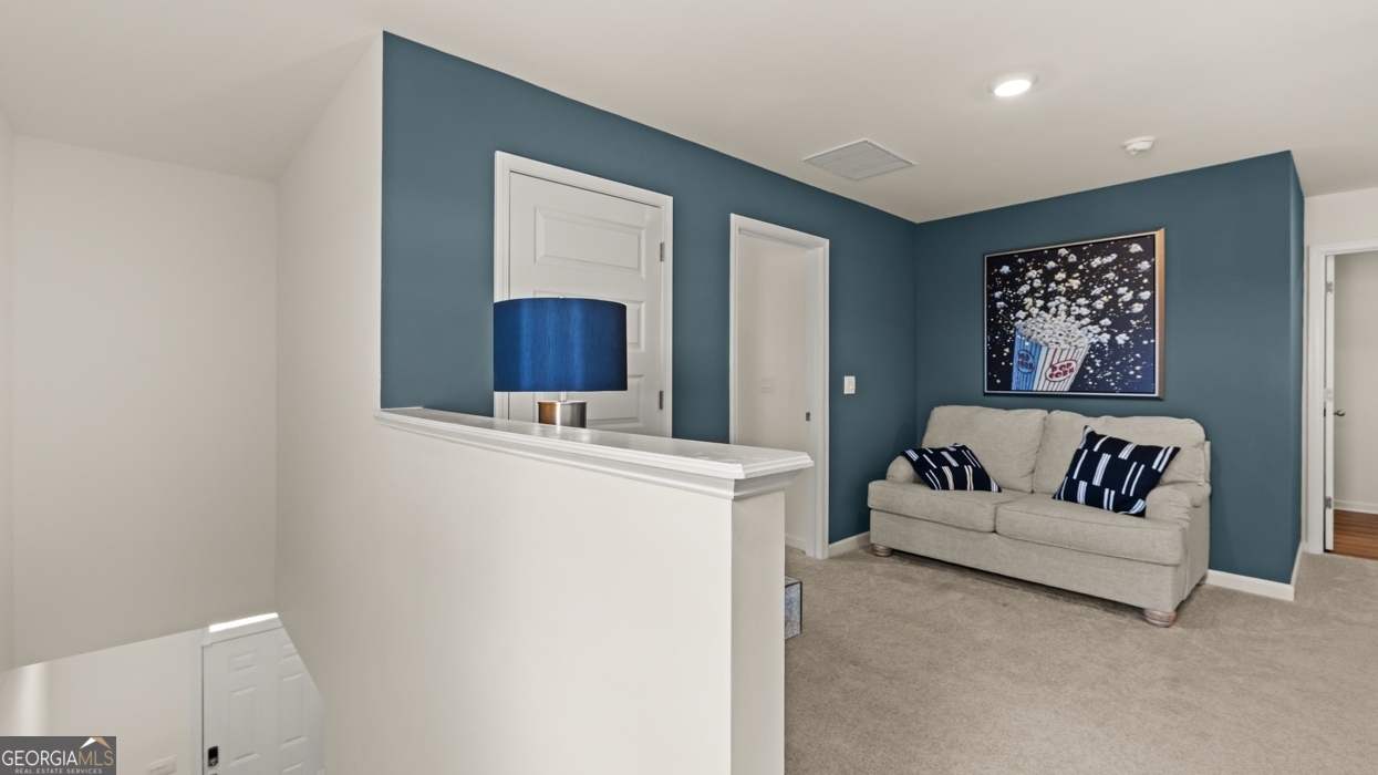 11933 Aukerman Way Hampton, GA 30228 - Photo 23 of 41 a living room with furniture and a table