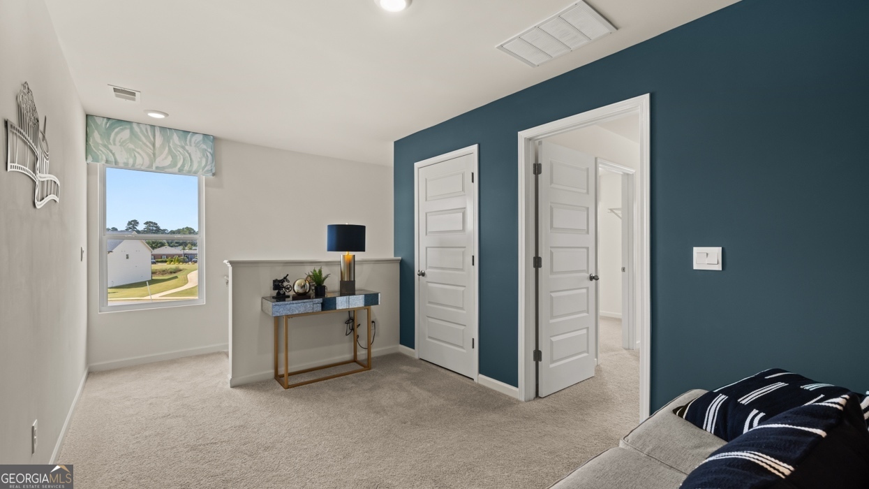 11933 Aukerman Way Hampton, GA 30228 - Photo 25 of 41 a view of a bedroom with a workspace