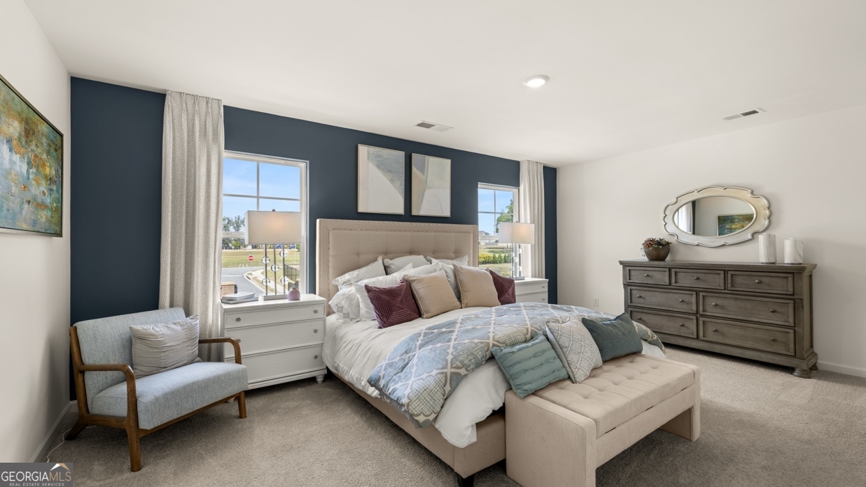 11933 Aukerman Way Hampton, GA 30228 - Photo 27 of 41 a bedroom with bed and window