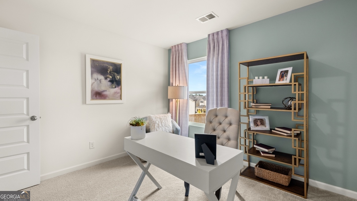 11933 Aukerman Way Hampton, GA 30228 - Photo 40 of 41 a view of a livingroom with furniture and window