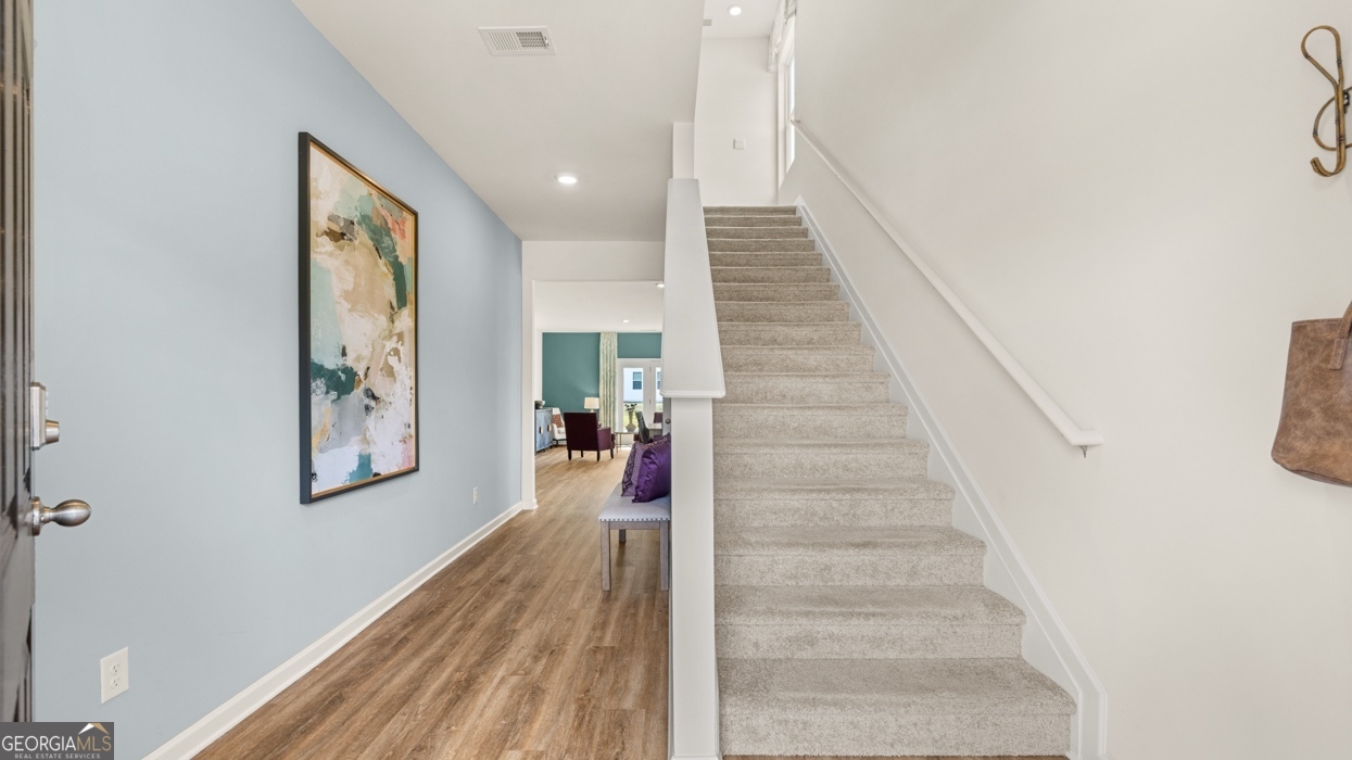 11933 Aukerman Way Hampton, GA 30228 - Photo 5 of 41 a view of entryway and hall with wooden floor