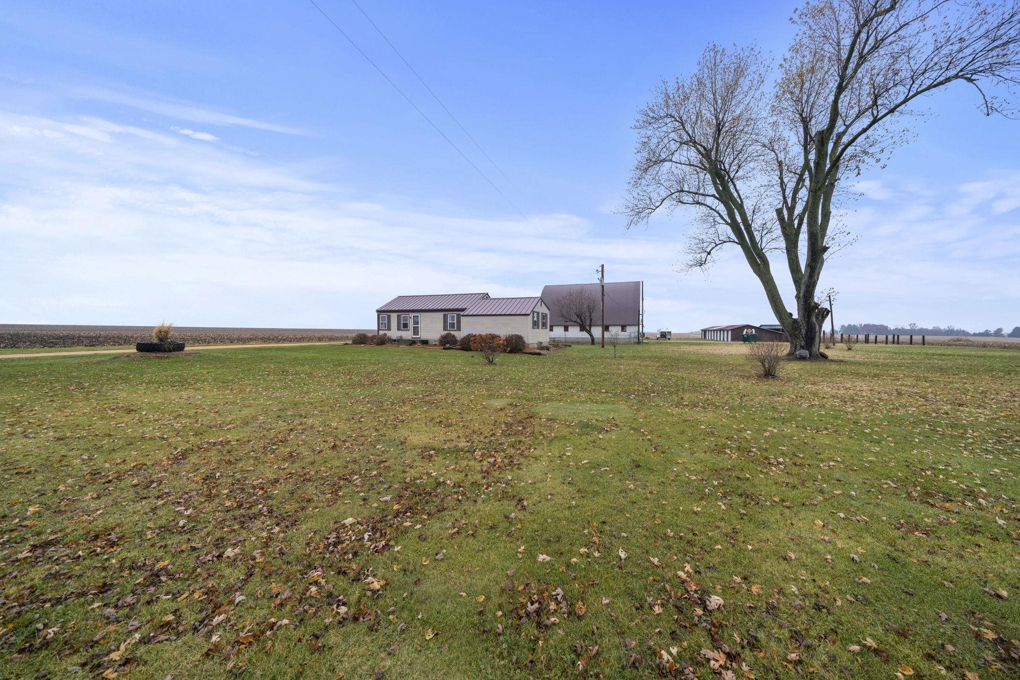 1684 North Mt Morris Road Mount Morris, IL 61054 - Photo 12 of 44 a view of a large body of water with a building in the background