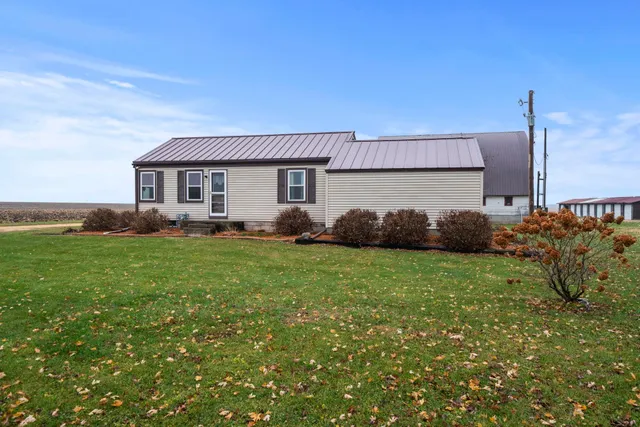a backyard of a house with lots of green space
