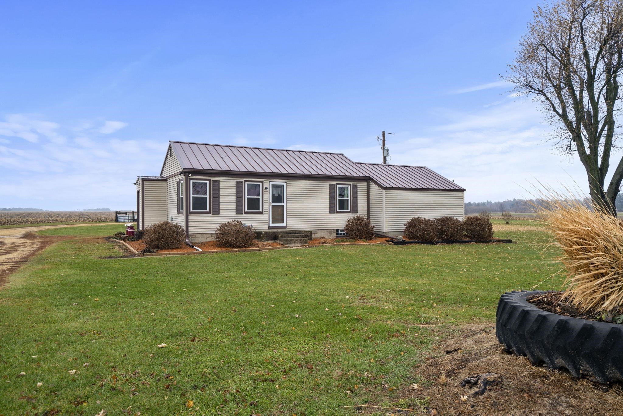 1684 North Mt Morris Road Mount Morris, IL 61054 - Photo 14 of 44 a front view of a house with a garden