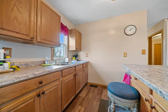 a kitchen with a sink cabinets and stove