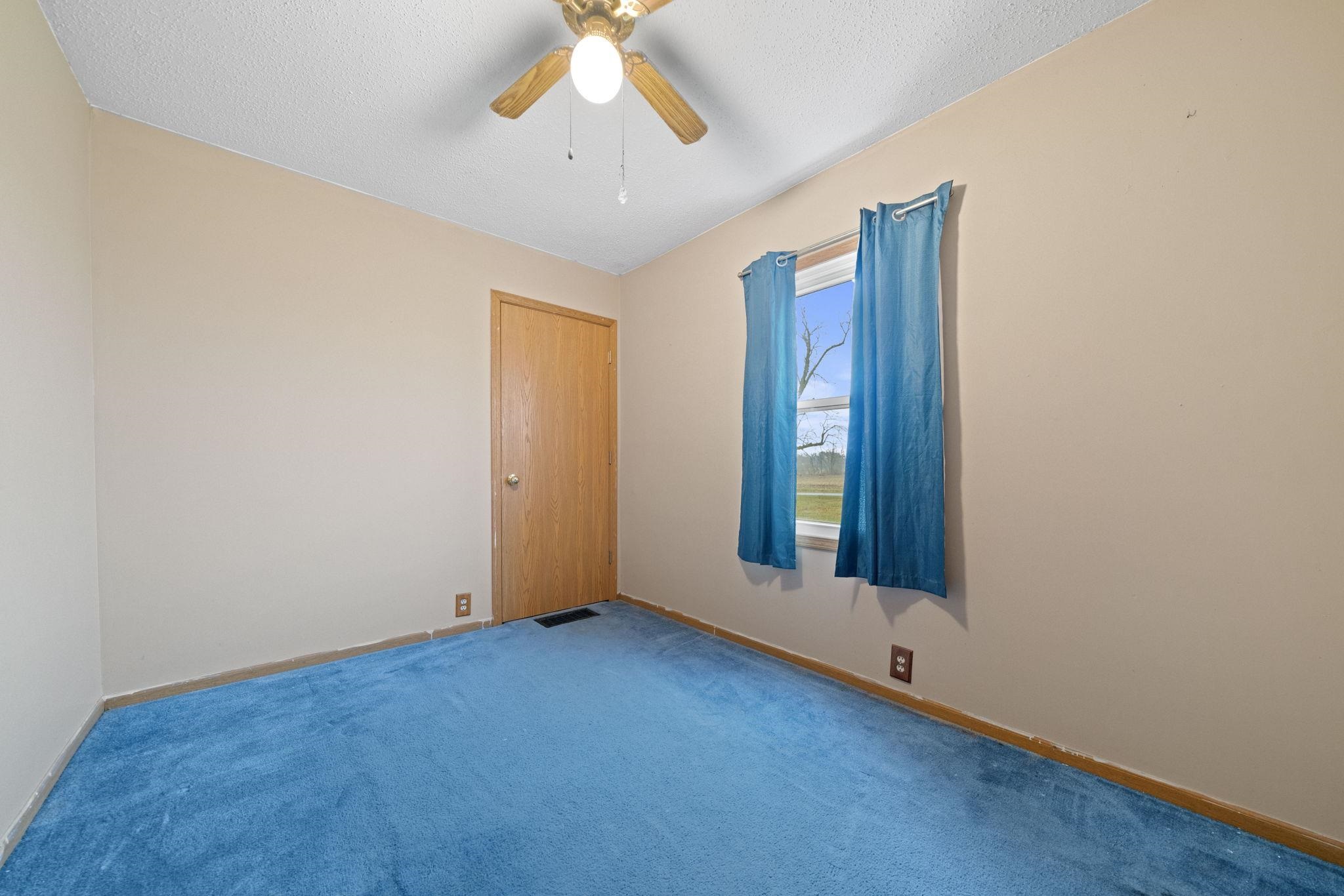 1684 North Mt Morris Road Mount Morris, IL 61054 - Photo 26 of 44 an empty room with windows and fan