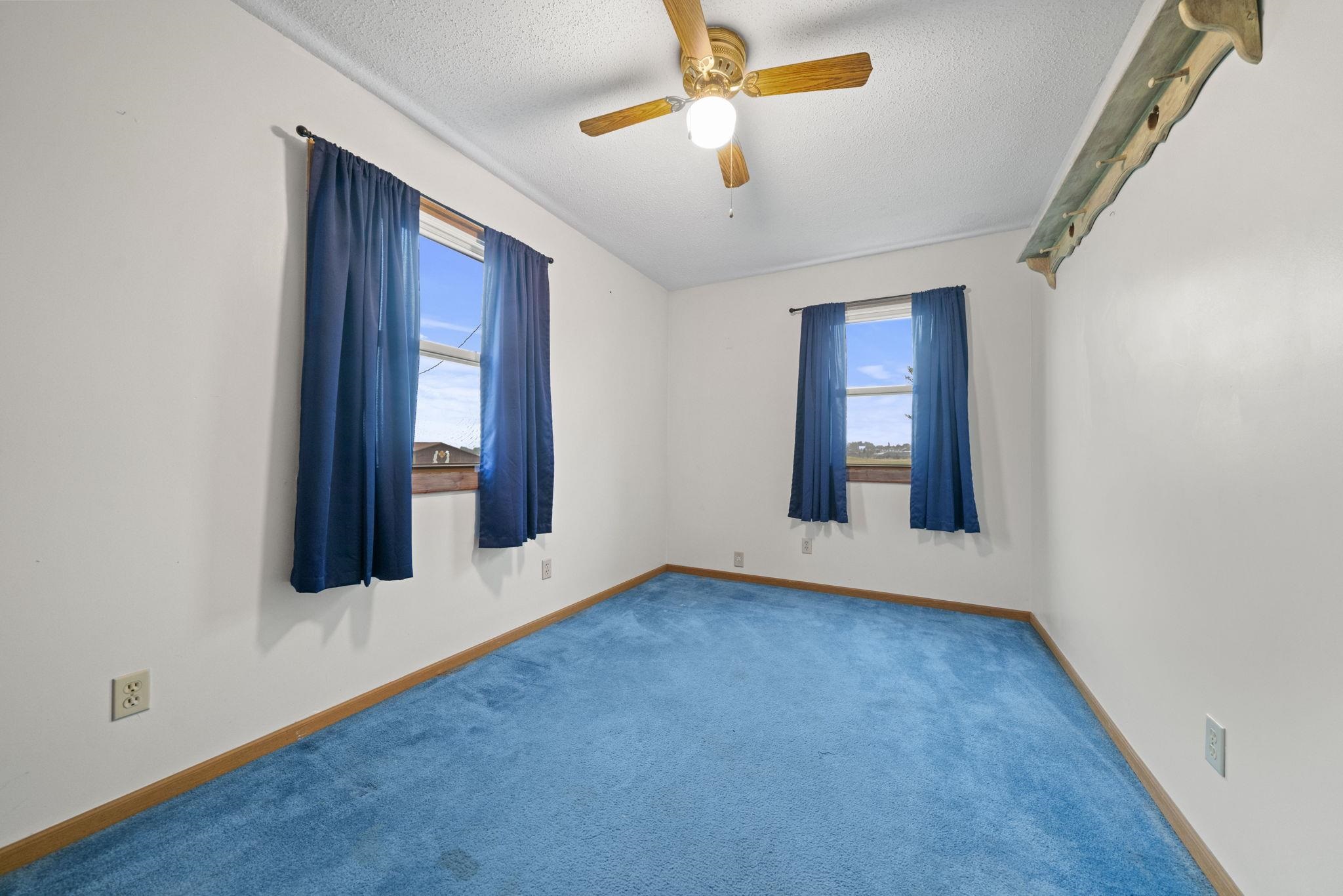 1684 North Mt Morris Road Mount Morris, IL 61054 - Photo 30 of 44 an empty room with windows and fan