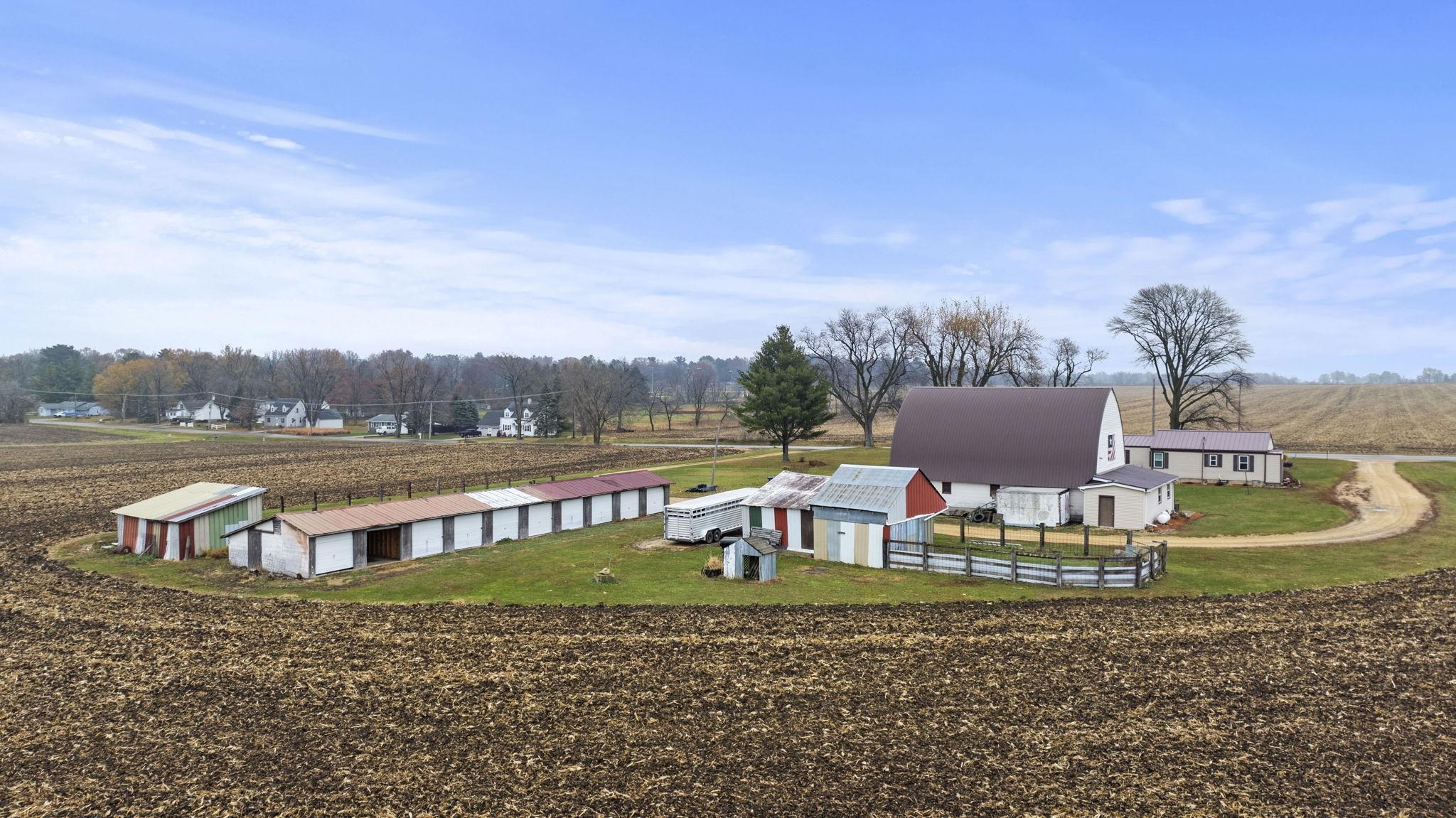 1684 North Mt Morris Road Mount Morris, IL 61054 - Photo 3 of 44 a view of swimming pool with outdoor seating and a garden