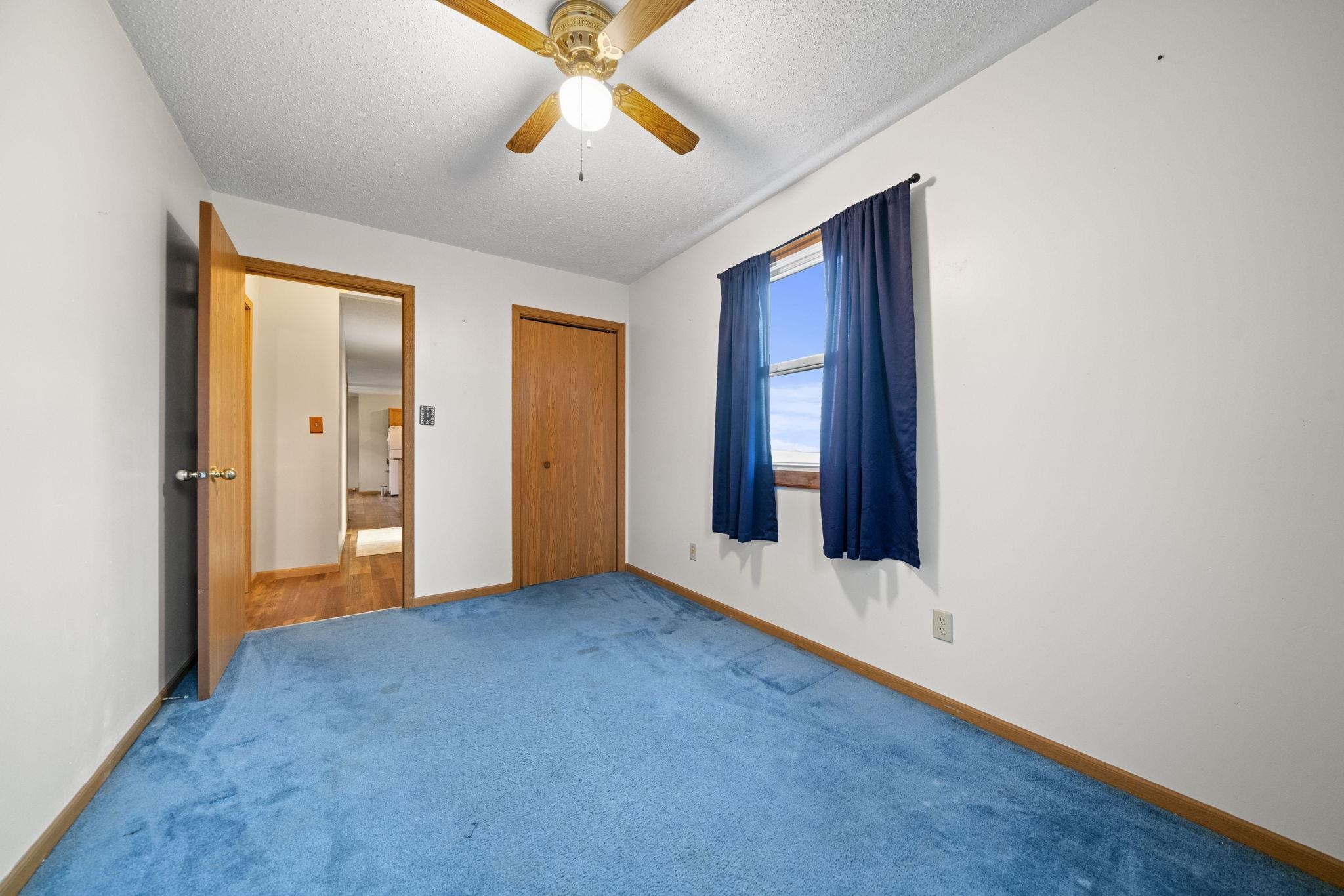 1684 North Mt Morris Road Mount Morris, IL 61054 - Photo 31 of 44 an empty room with closet and chandelier fan