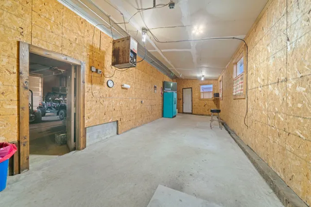 a view of hallway with a bathroom