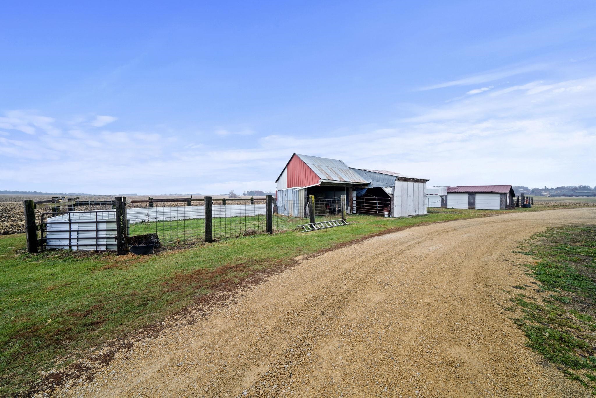 1684 North Mt Morris Road Mount Morris, IL 61054 - Photo 41 of 44 a front view of a house with a yard and garage