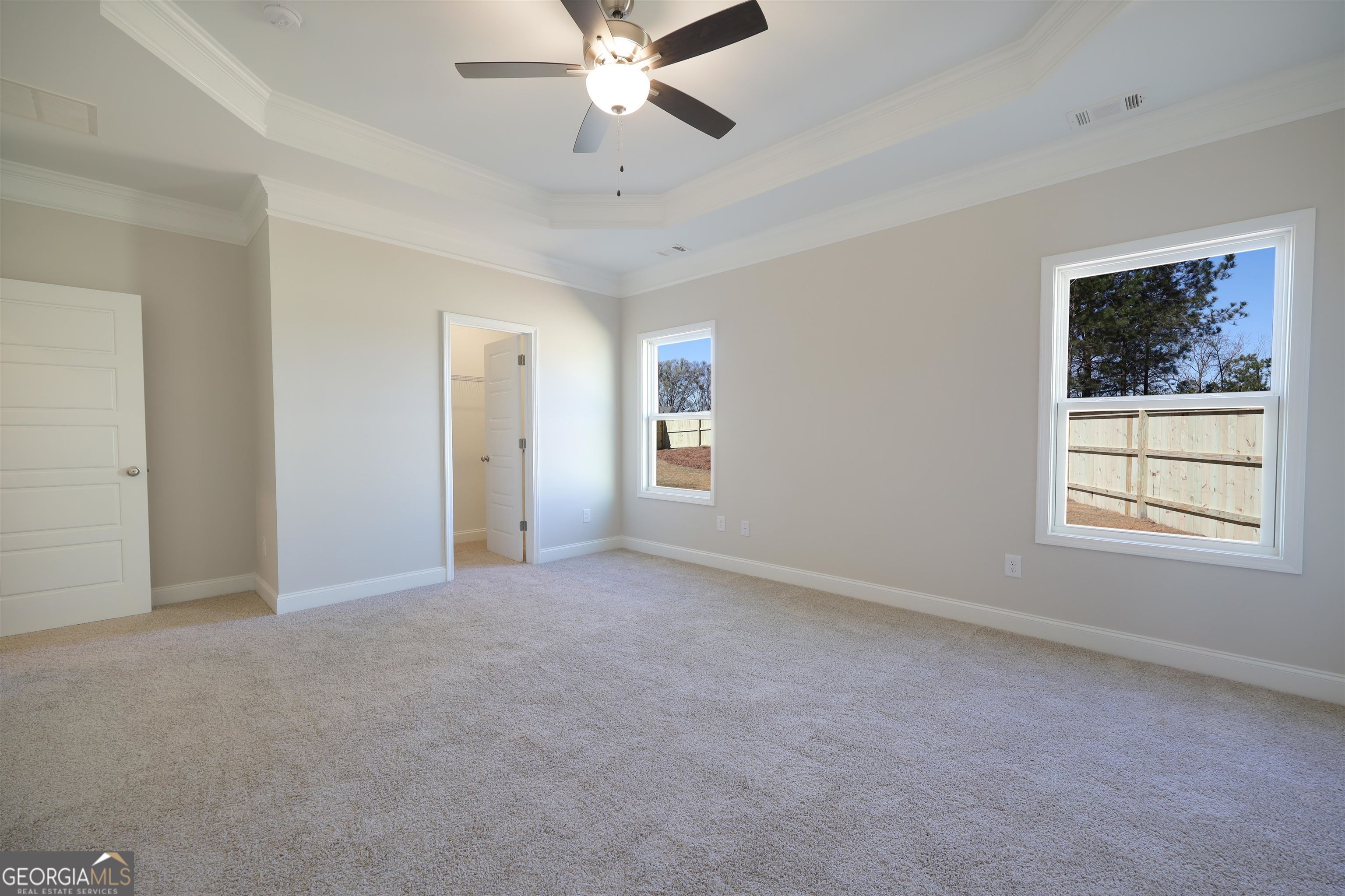 230 Delightful Way, Unit 23 Winder, GA 30680 - Photo 15 of 26 a view of an empty room with a window