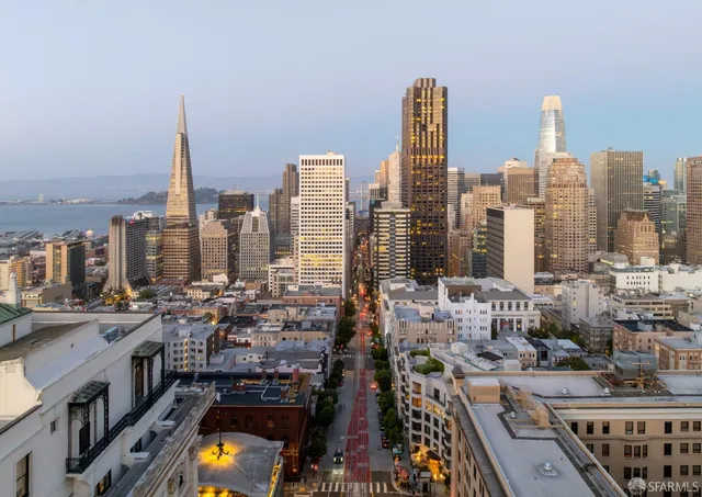 a bathroom with a sink toilet and mirror