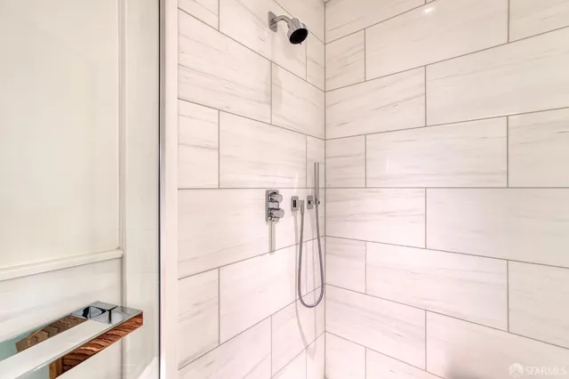 a bathroom with a sink toilet and mirror
