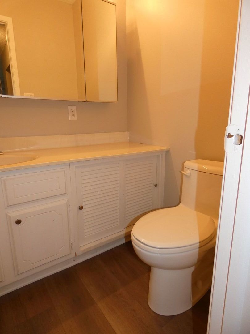 1501 Woodbridge Road, Unit 3C Joliet, IL 60436 - Photo 11 of 24 a bathroom with a toilet and a sink