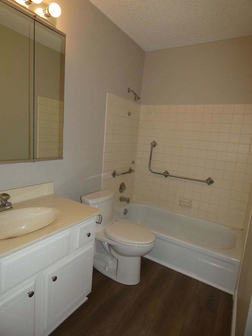 1501 Woodbridge Road, Unit 3C Joliet, IL 60436 - Photo 15 of 24 a bathroom with a sink a toilet and shower