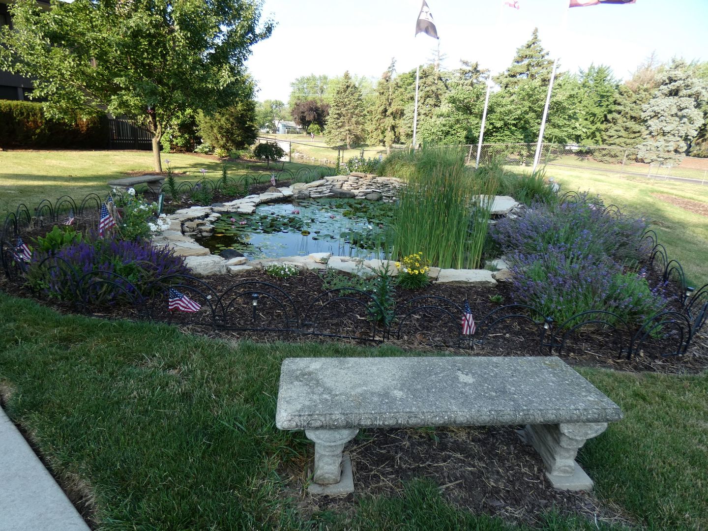 1501 Woodbridge Road, Unit 3C Joliet, IL 60436 - Photo 20 of 24 a view of a garden with a fountain