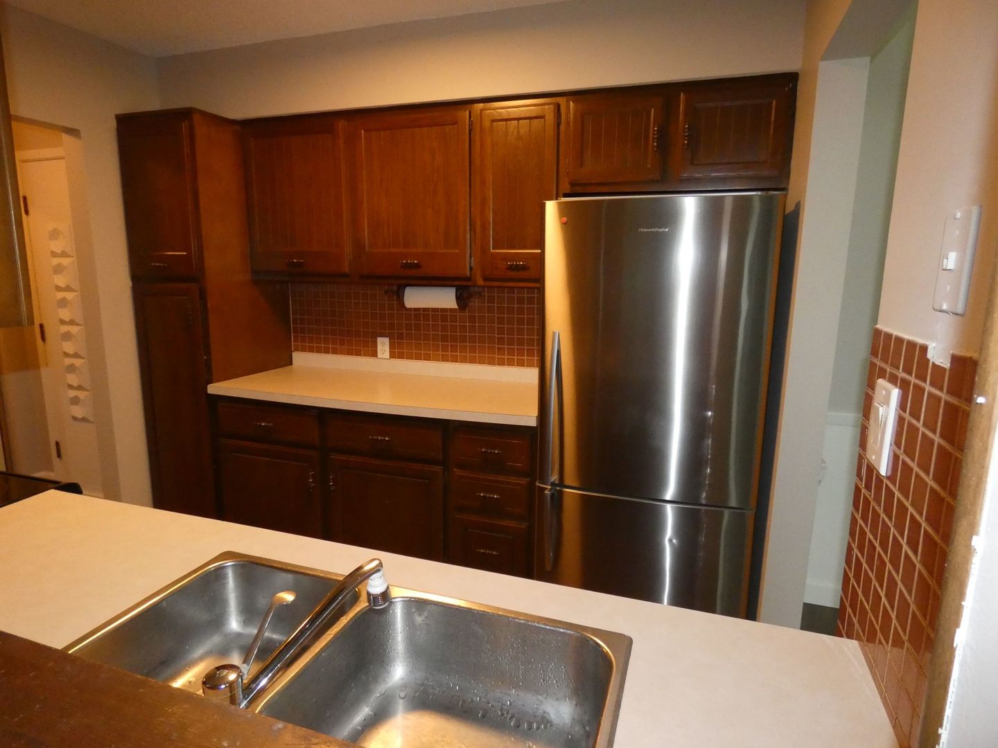 1501 Woodbridge Road, Unit 3C Joliet, IL 60436 - Photo 5 of 24 a kitchen with a refrigerator and cabinets