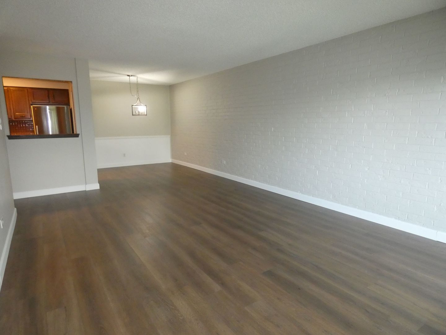 1501 Woodbridge Road, Unit 3C Joliet, IL 60436 - Photo 7 of 24 a view of empty room with wooden floor