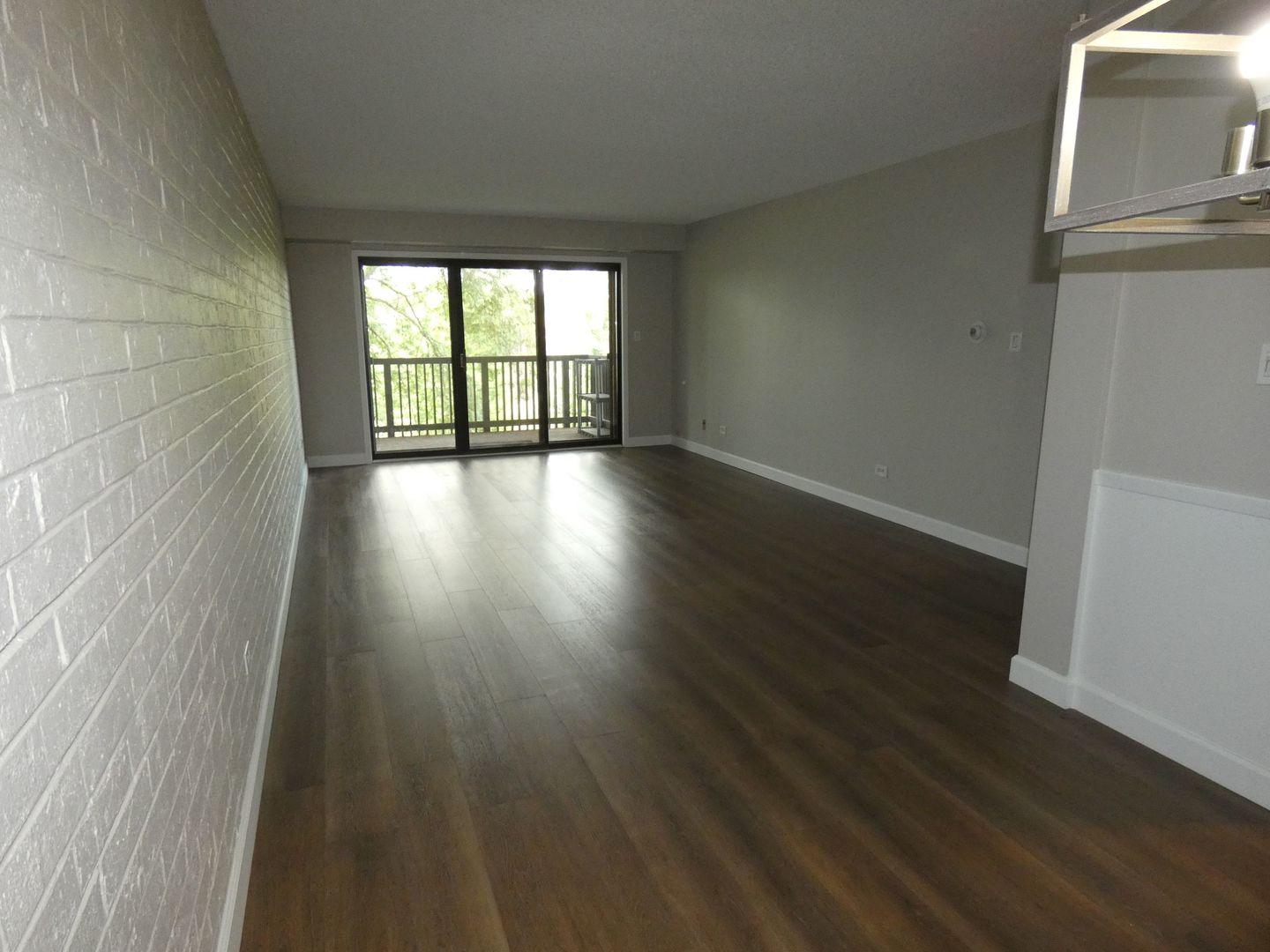 1501 Woodbridge Road, Unit 3C Joliet, IL 60436 - Photo 9 of 24 wooden floor in an empty room with a window