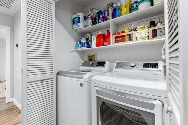 a bedroom with furniture and a large window