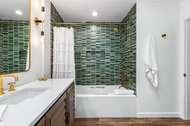 a bathroom with a bathtub and a sink