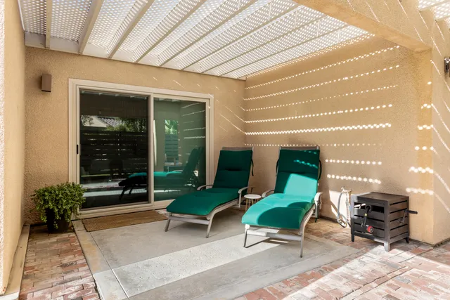 a view of a garden with a building in the background