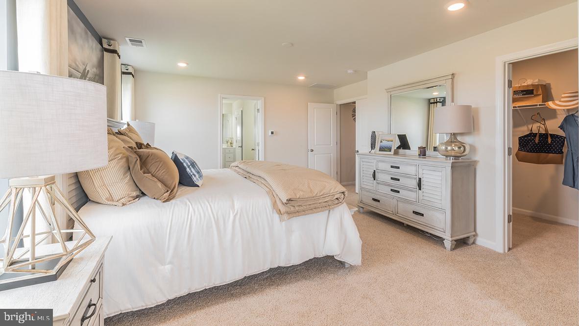22 Georgetown Drive Freehold, NJ 07728 - Photo 22 of 24 a bedroom with a bed and a cabinets