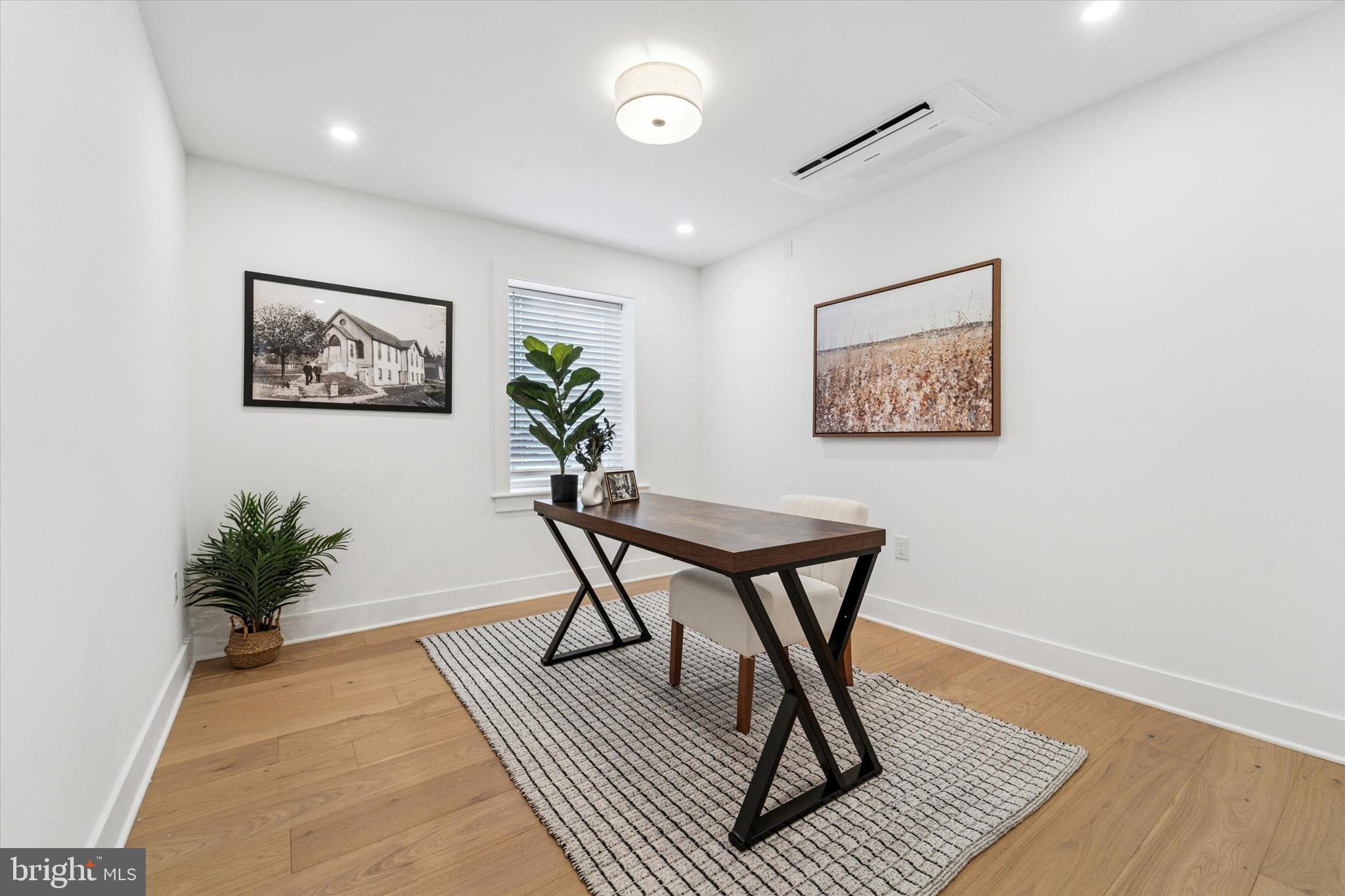 25 North Ridge Avenue, Unit A Ambler, PA 19002 - Photo 14 of 26 a workspace room with furniture and wooden floor