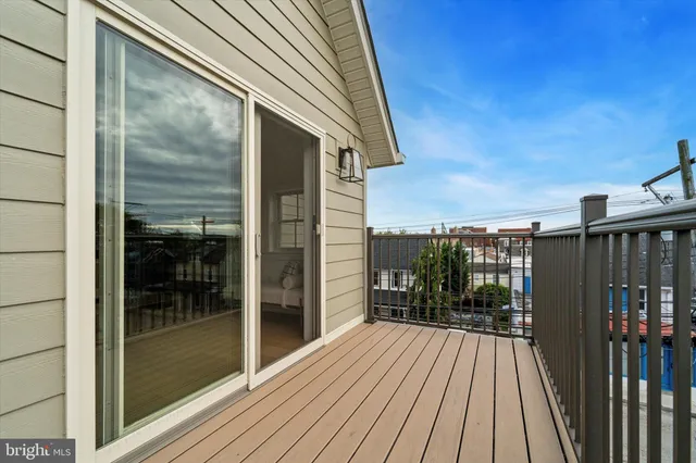 a view of balcony with wooden floor