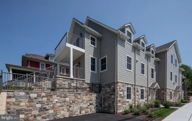 a front view of a building with balcony