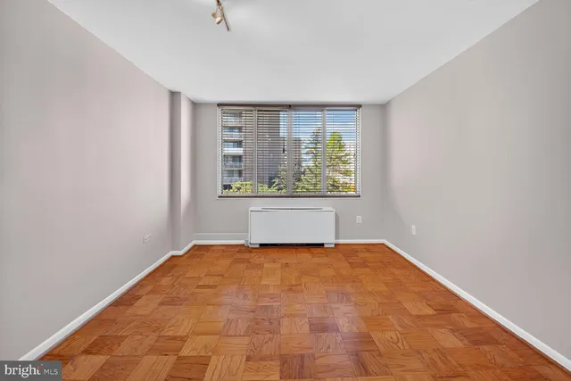 a view of an empty room with a window