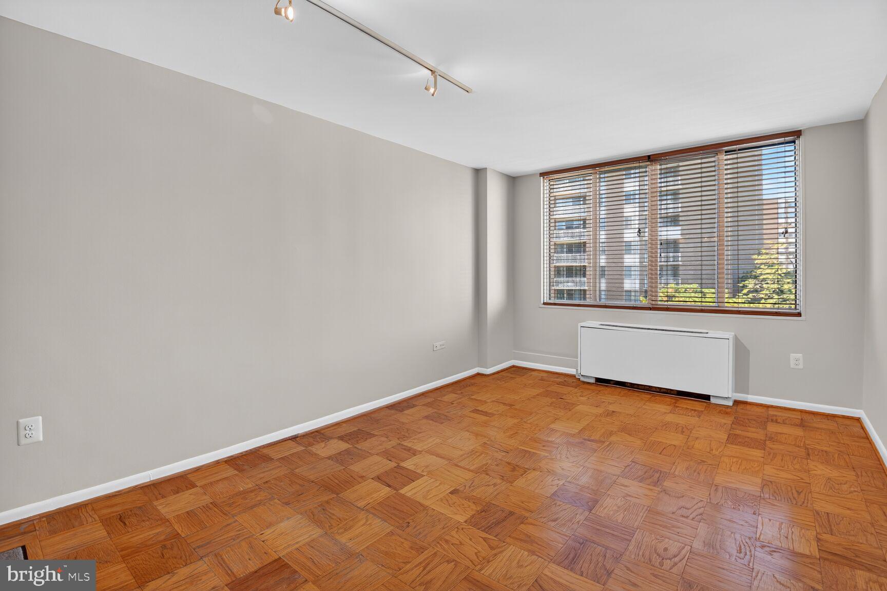 2939 Van Ness Street Northwest, Unit 941 Washington, DC 20008 - Photo 12 of 42 a view of an empty room with a window