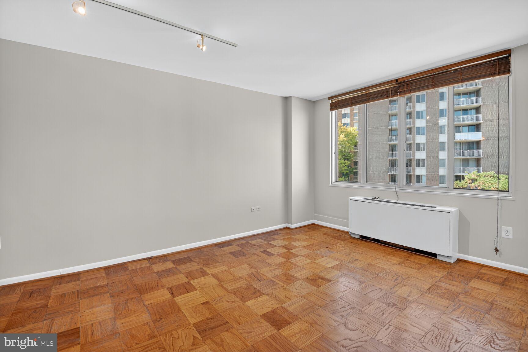 2939 Van Ness Street Northwest, Unit 941 Washington, DC 20008 - Photo 16 of 42 a view of an empty room with a window