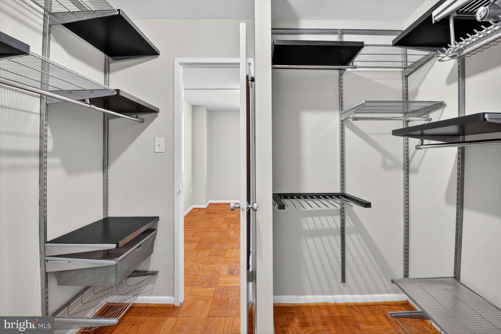 2939 Van Ness Street Northwest, Unit 941 Washington, DC 20008 - Photo 25 of 42 a view of walk in closet with clothes and shoes