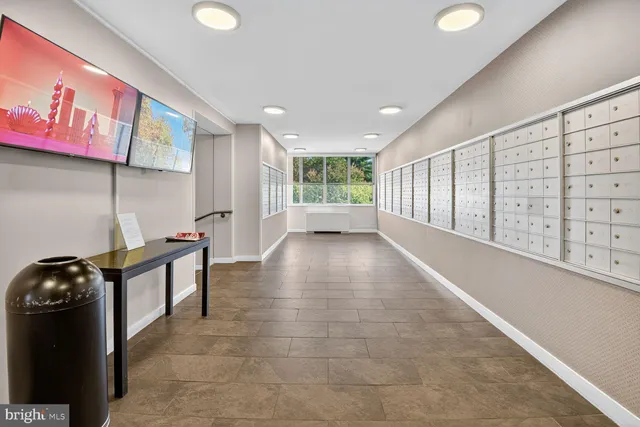 a view of a hallway with windows