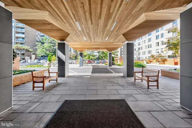 a view of a porch with chairs and backyard