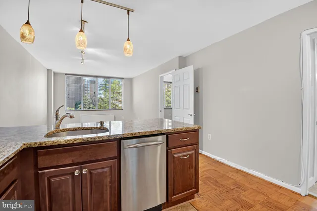 a kitchen with a sink and a window