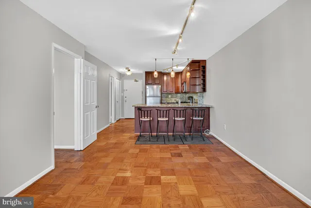 a view of kitchen with furniture and wooden floor