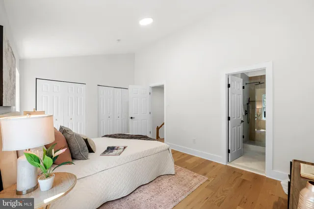 a bedroom with a bed and a couch