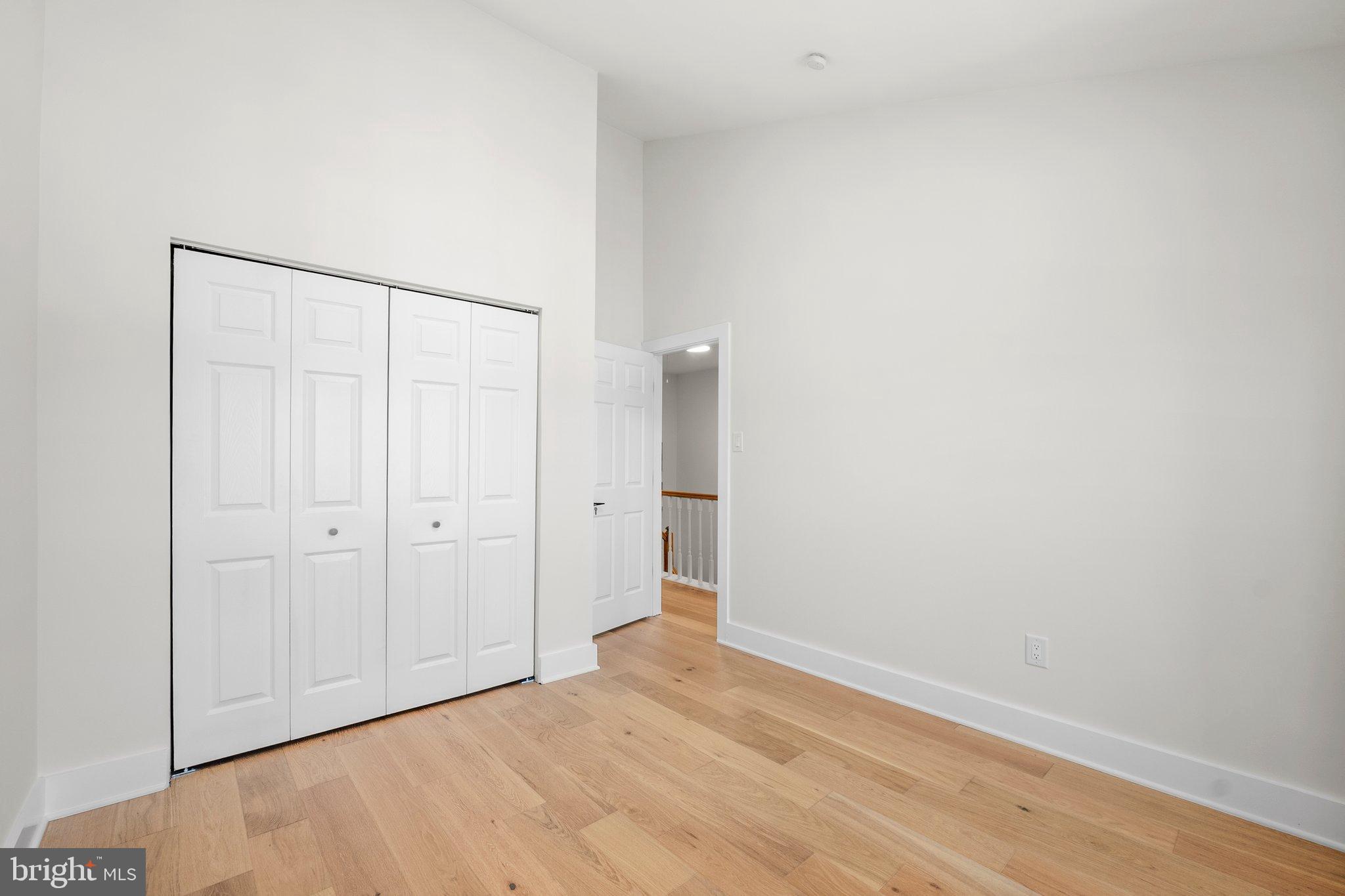 6213 Manchester Way Elkridge, MD 21075 - Photo 21 of 31 a view of an empty room with wooden floor