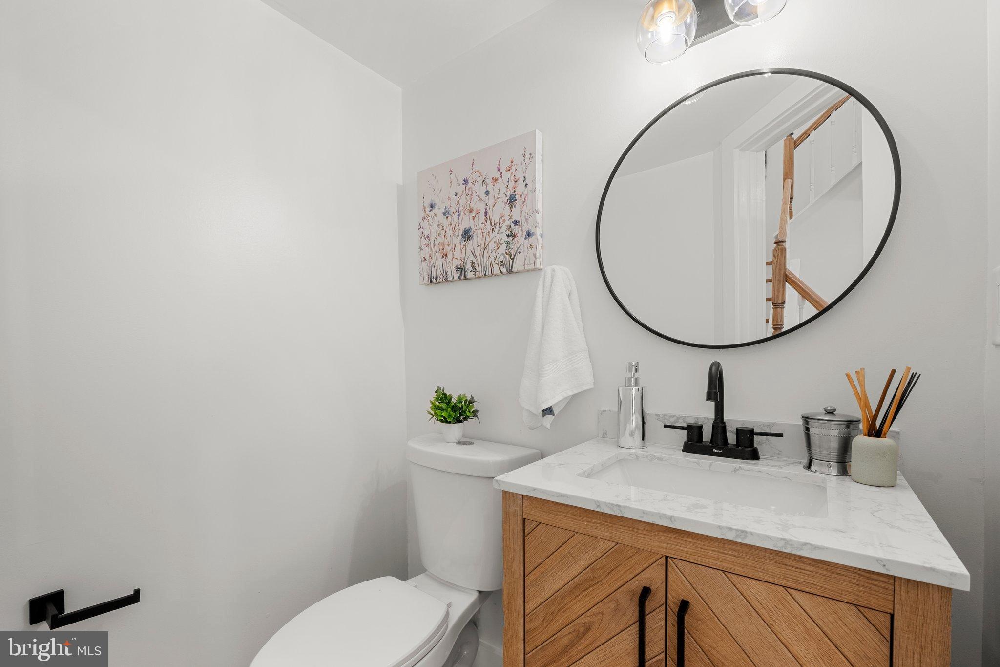 6213 Manchester Way Elkridge, MD 21075 - Photo 27 of 31 a bathroom with a sink mirror and toilet