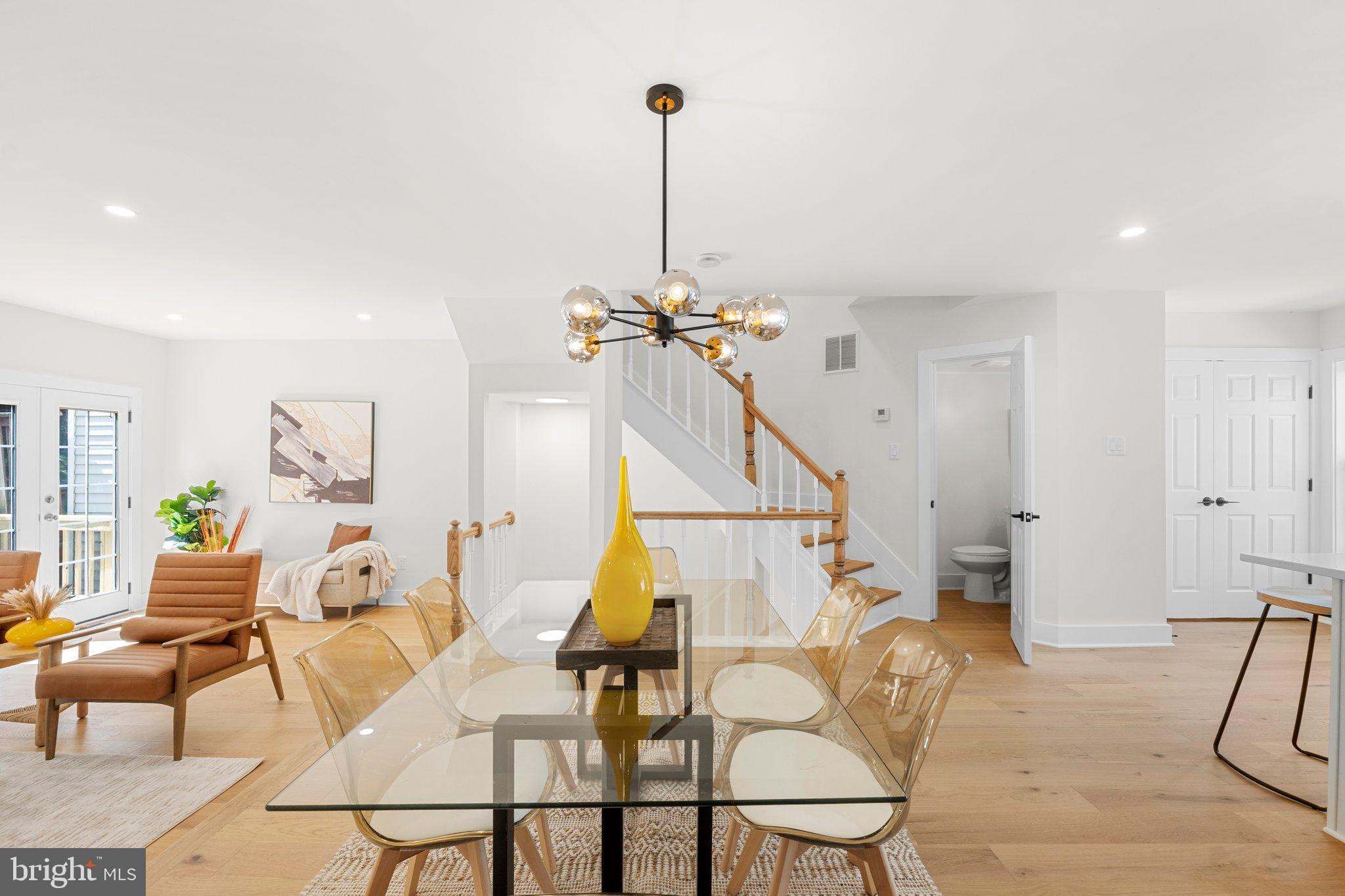 6213 Manchester Way Elkridge, MD 21075 - Photo 5 of 31 a view of a dining room with furniture and a chandelier