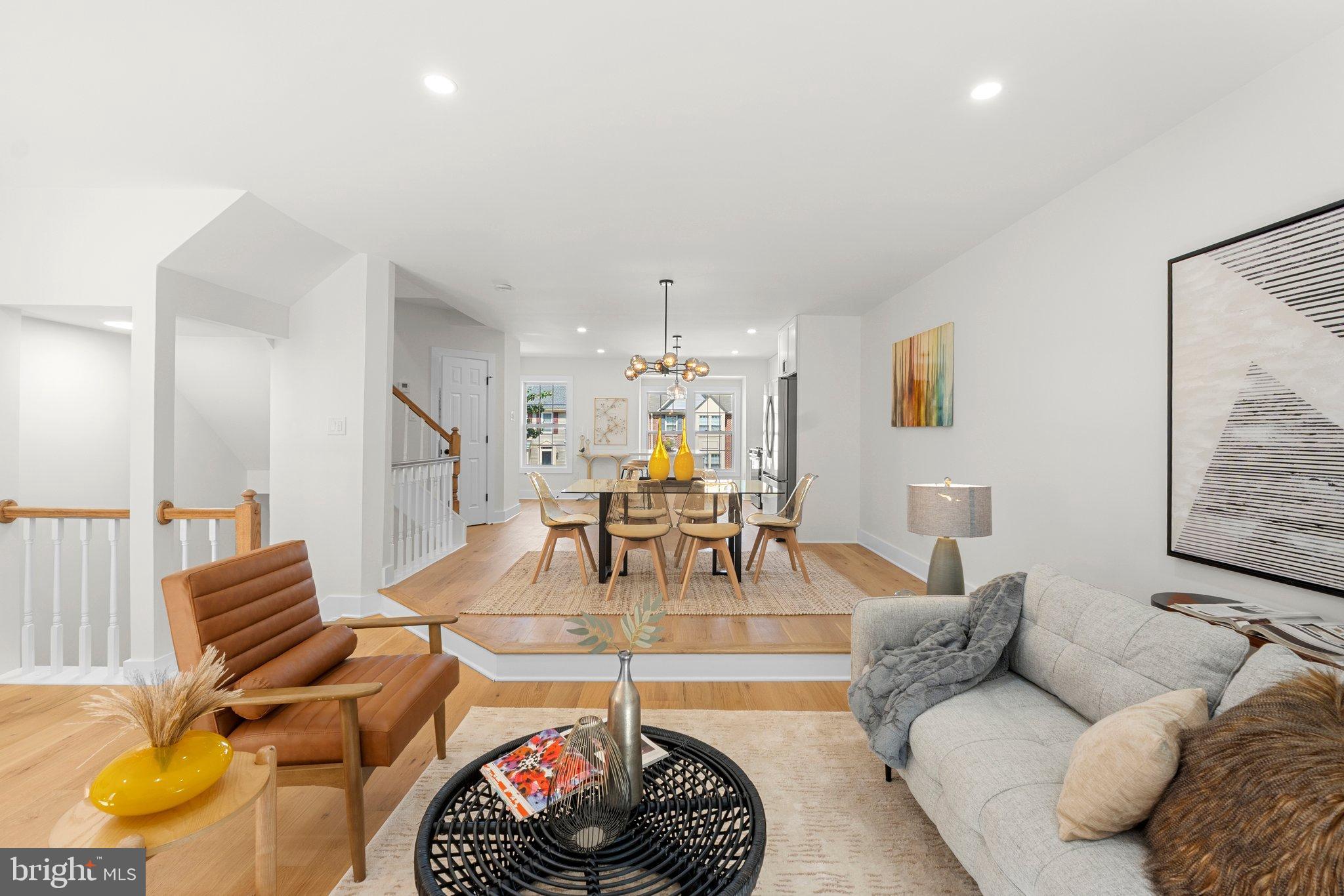 6213 Manchester Way Elkridge, MD 21075 - Photo 9 of 31 a living room with furniture and a chandelier