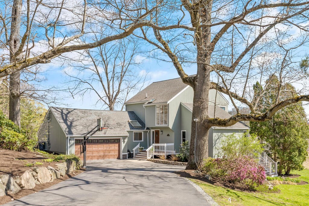 164 Marrett Road Lexington, MA 02421 - Photo 1 of 41 a view of a street with houses and trees