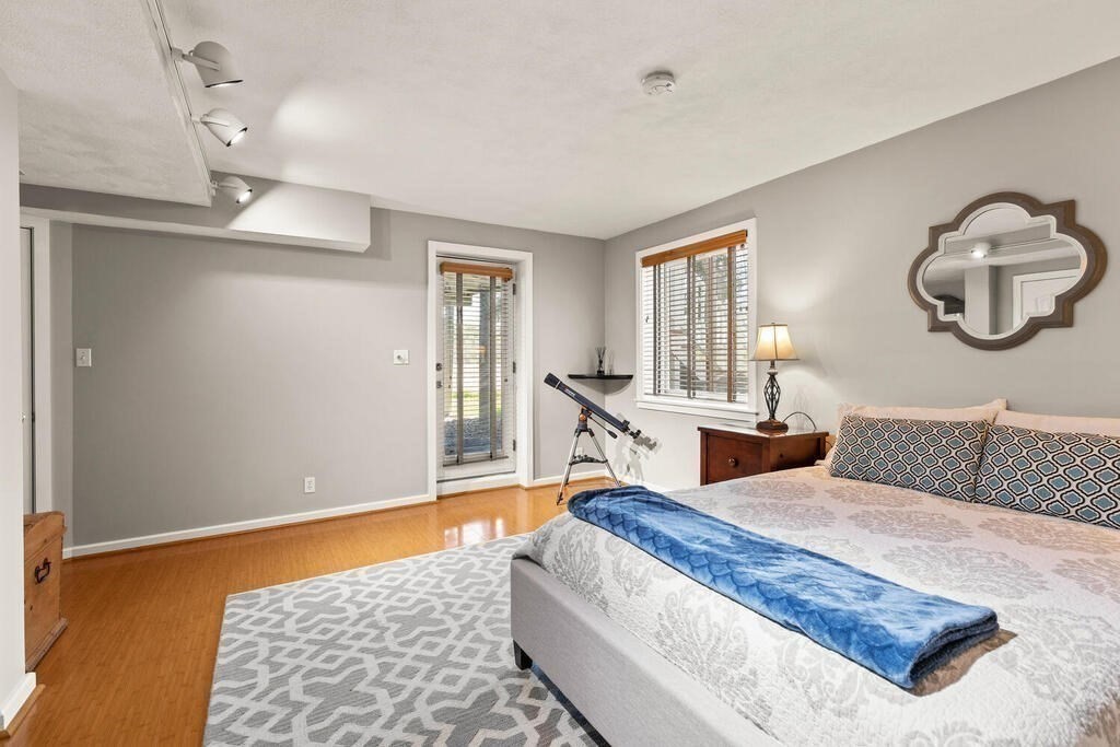 164 Marrett Road Lexington, MA 02421 - Photo 19 of 41 a bed room with a bed and window