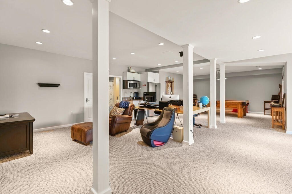 164 Marrett Road Lexington, MA 02421 - Photo 20 of 41 a view of a livingroom with furniture and a ceiling fan