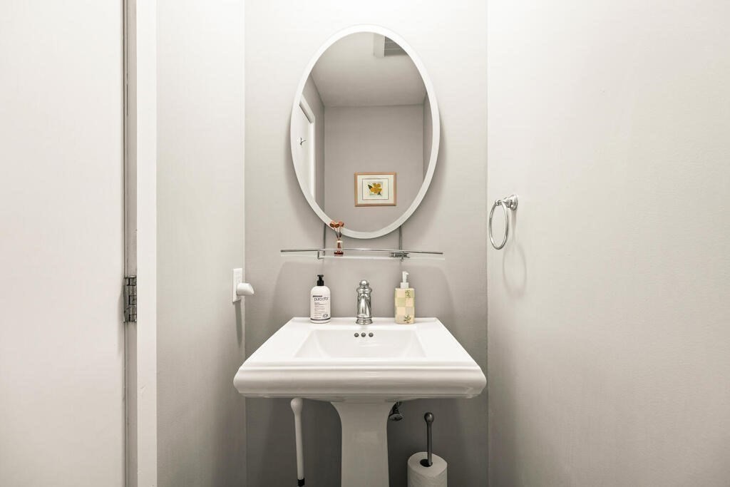 164 Marrett Road Lexington, MA 02421 - Photo 25 of 41 a bathroom with a sink and a mirror